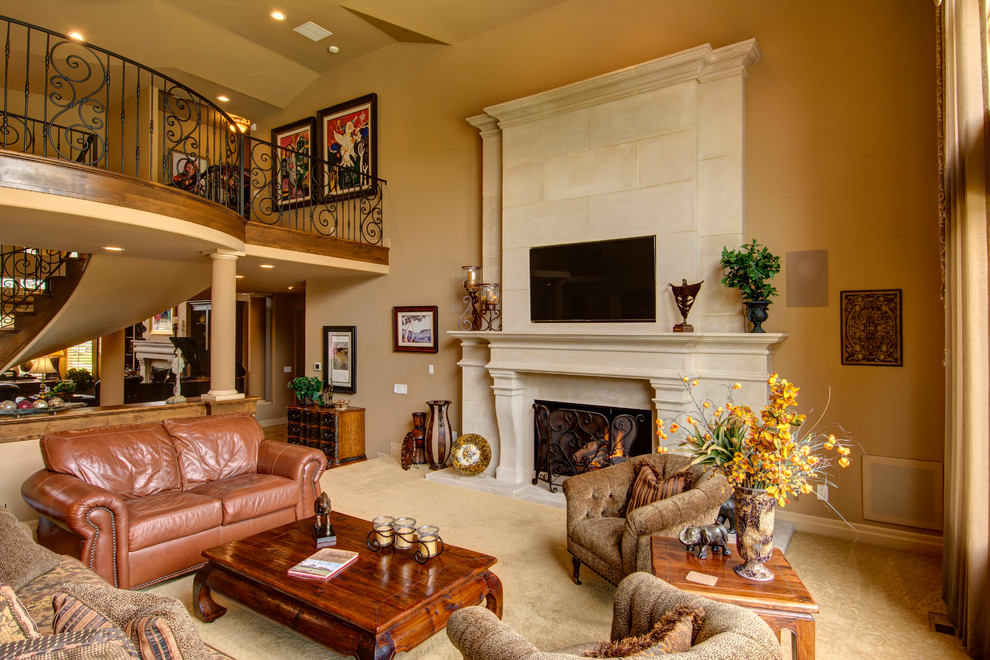 Photo of a large traditional open concept family room in Denver with yellow walls, carpet, a standard fireplace and a wall-mounted tv.