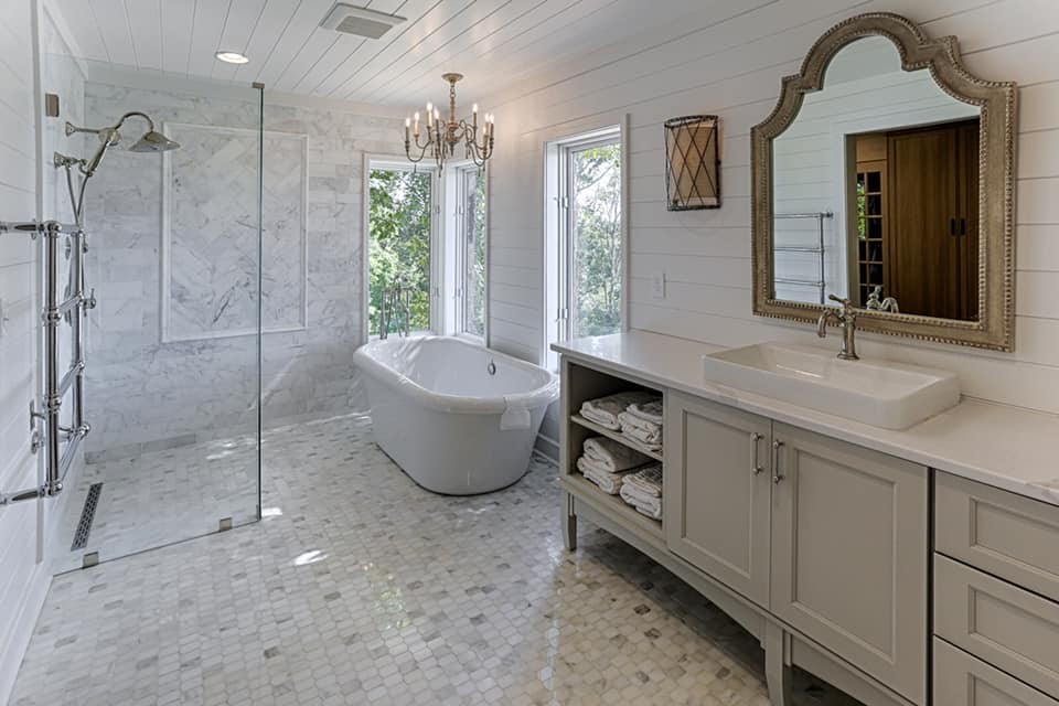 Example of a large transitional master cement tile floor walk-in shower design with flat-panel cabinets, gray cabinets, white walls, quartz countertops and white countertops