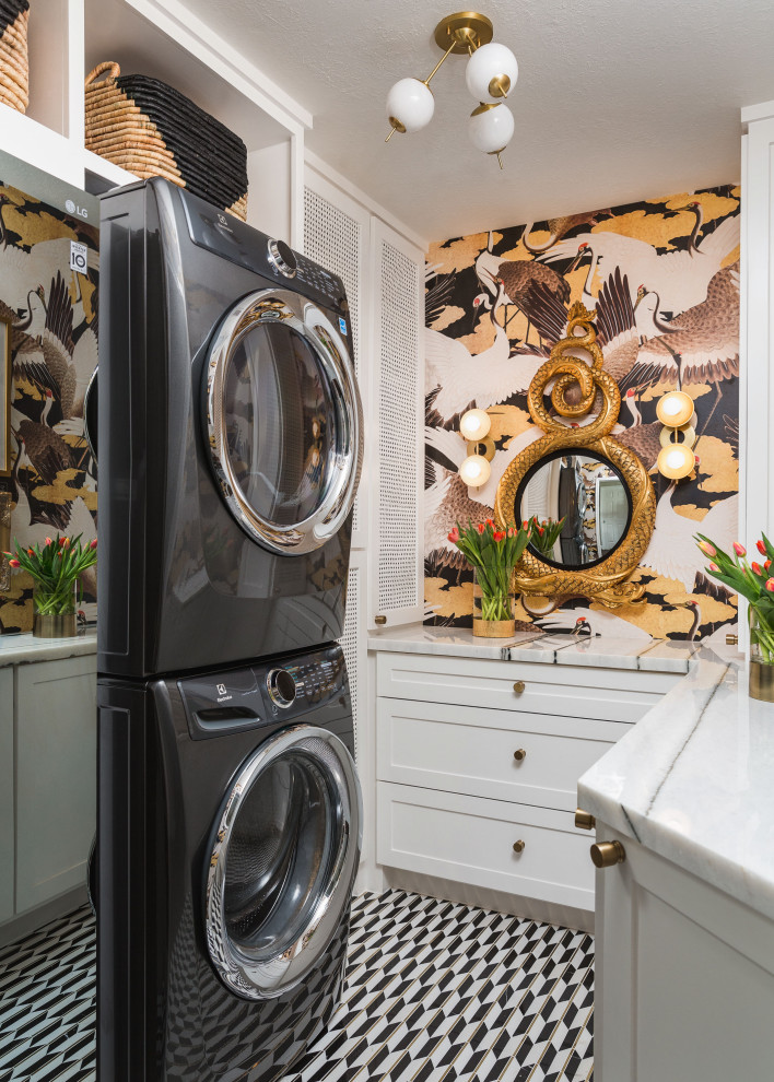 This is an example of a small eclectic laundry room in Houston with shaker cabinets, white cabinets, marble benchtops, marble floors, white benchtop and wallpaper.