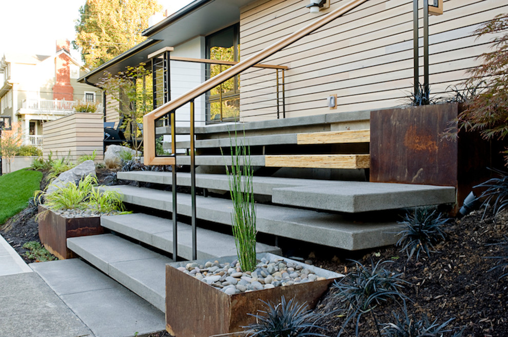 This is an example of a midcentury concrete floating staircase in Portland.