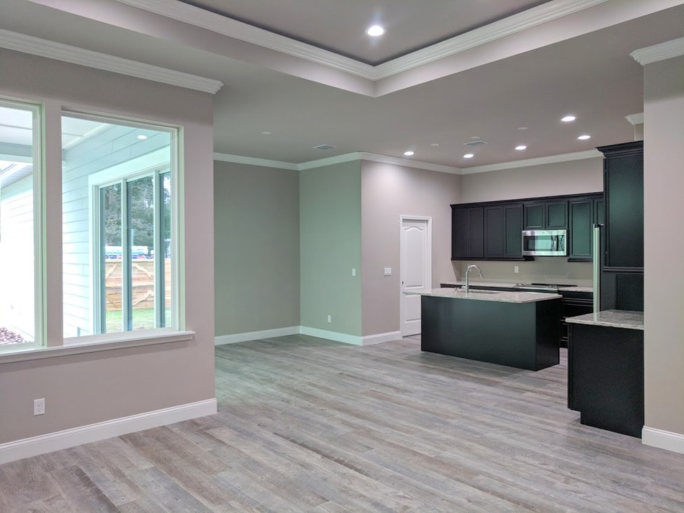 This is an example of a large contemporary living room in Orlando with grey walls, porcelain floors and grey floor.