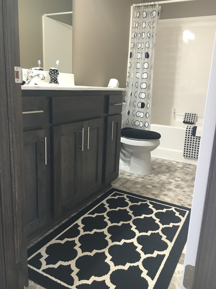 Design ideas for a mid-sized modern master bathroom in Other with raised-panel cabinets, dark wood cabinets, an alcove tub, a shower/bathtub combo, beige walls, vinyl floors, quartzite benchtops, beige floor and a shower curtain.