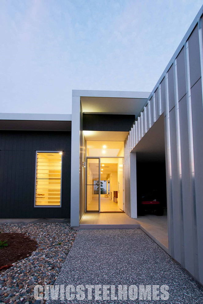 Photo of a mid-sized contemporary front door in Brisbane with white walls, porcelain floors, a single front door and a white front door.