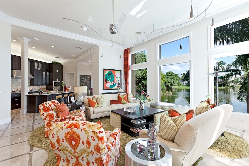 Photo of a mid-sized contemporary open concept living room in Miami with white walls, ceramic floors and beige floor.