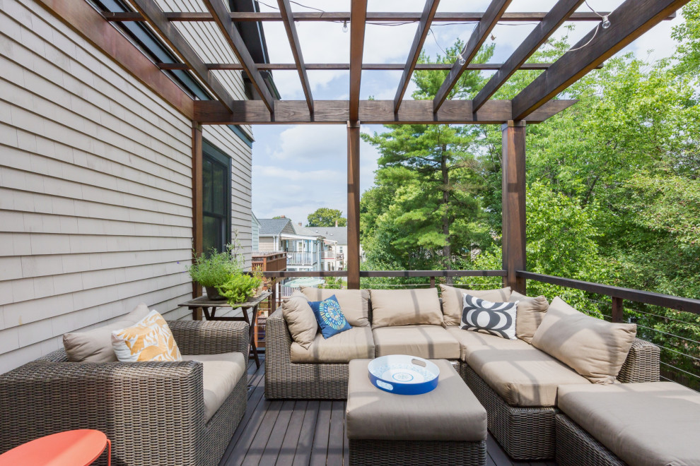 Design ideas for a transitional deck in Boston with a pergola.