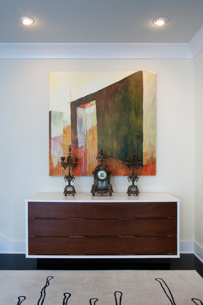Inspiration for a small transitional dark wood floor and brown floor foyer remodel with white walls