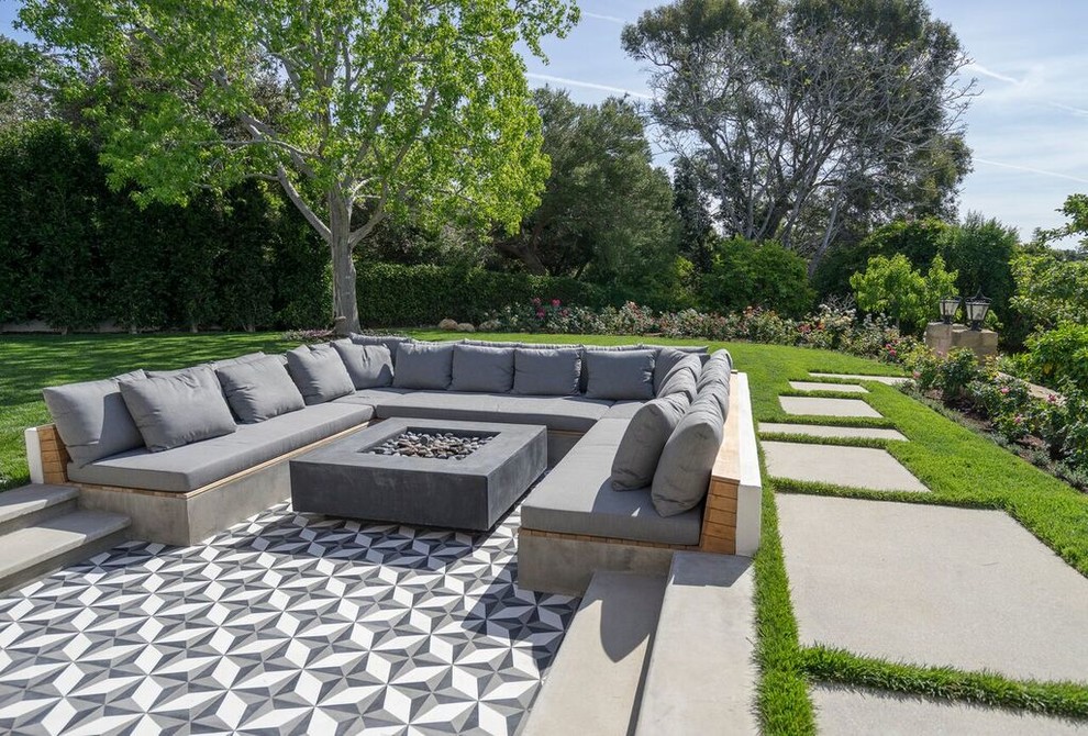 Inspiration for a large contemporary backyard patio in Santa Barbara with a fire feature, tile and no cover.