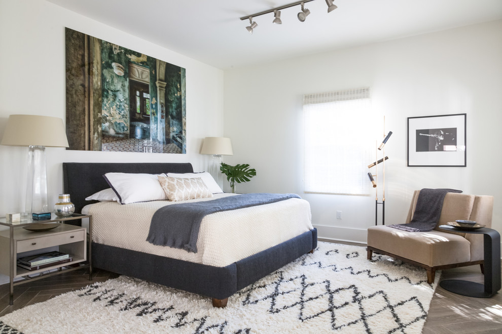 This is an example of a mid-sized transitional guest bedroom in New Orleans with white walls and porcelain floors.