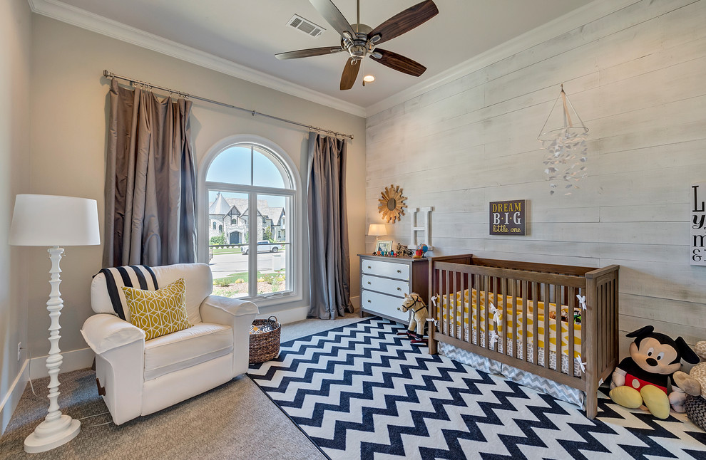 Large transitional gender-neutral nursery in Dallas with beige walls and carpet.