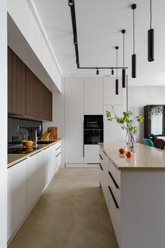Design ideas for a contemporary l-shaped open plan kitchen in Saint Petersburg with flat-panel cabinets, white cabinets, black appliances, concrete flooring, an island, grey floors and beige worktops.