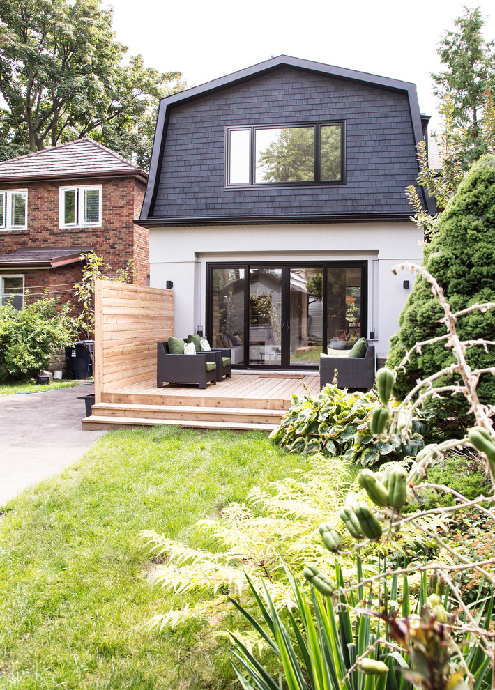Mid-sized transitional backyard deck photo in Toronto with no cover