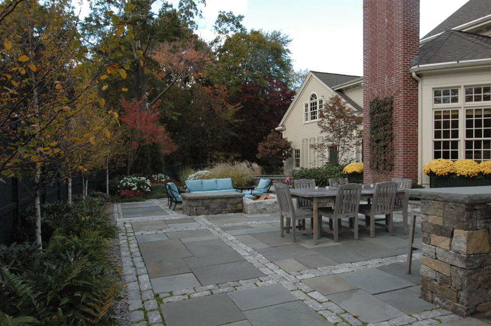 This is an example of a traditional patio in Boston with no cover.