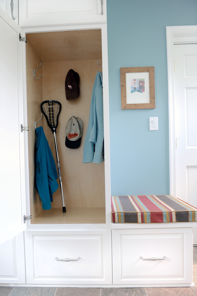 Inspiration for a small transitional slate floor mudroom remodel in Baltimore with blue walls