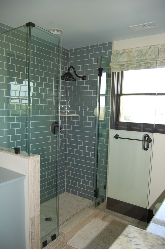 Design ideas for a country master bathroom in DC Metro with blue cabinets, a corner shower, a one-piece toilet, blue tile, subway tile, beige walls, ceramic floors and granite benchtops.