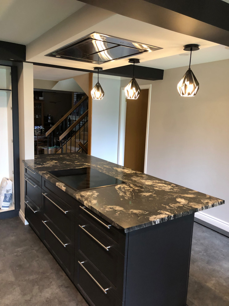 Inspiration for a mid-sized transitional concrete floor and gray floor enclosed kitchen remodel in Ottawa with shaker cabinets, black cabinets, granite countertops, multicolored backsplash, an island and multicolored countertops