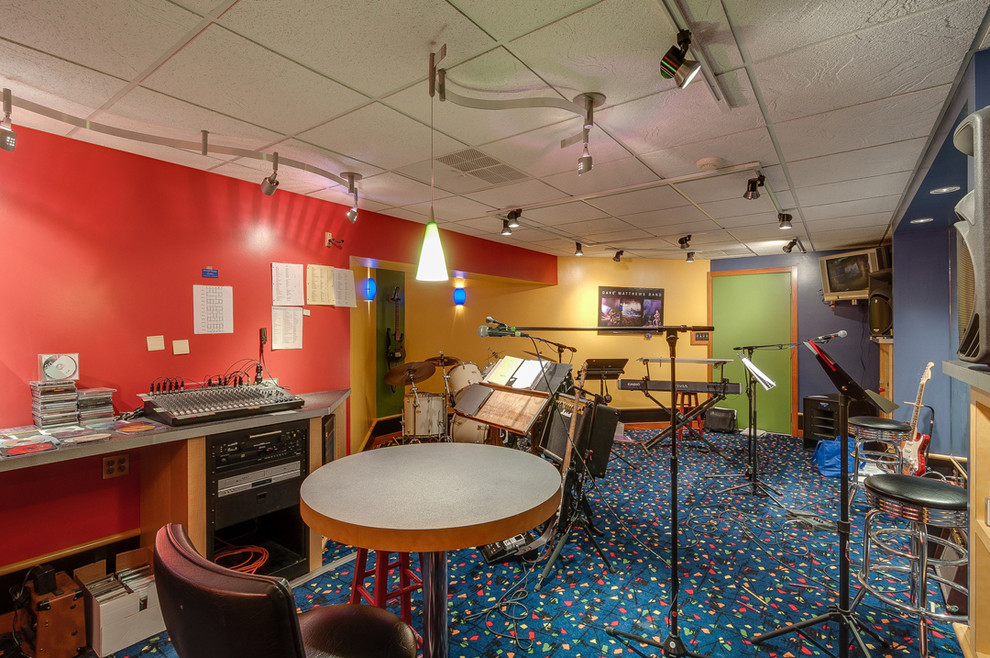 Photo of a large arts and crafts enclosed family room in Chicago with a music area, multi-coloured walls, carpet and no fireplace.