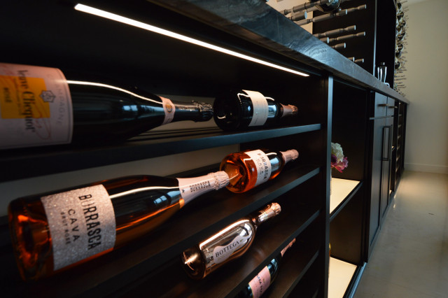 Black Wooden Wine Room Shelves as Additional, Contemporary-Looking Storage Units modern-vinkaellare