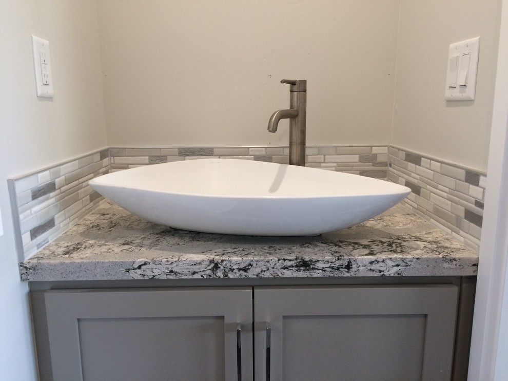 Inspiration for a small transitional 3/4 bathroom in Phoenix with shaker cabinets, grey cabinets, gray tile, multi-coloured tile, white tile, matchstick tile, grey walls, a vessel sink and marble benchtops.