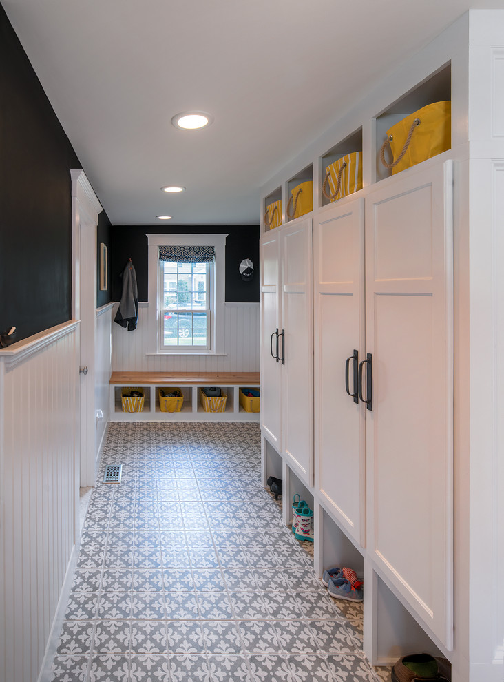 Design ideas for a mid-sized country mudroom in Boston with porcelain floors and a single front door.