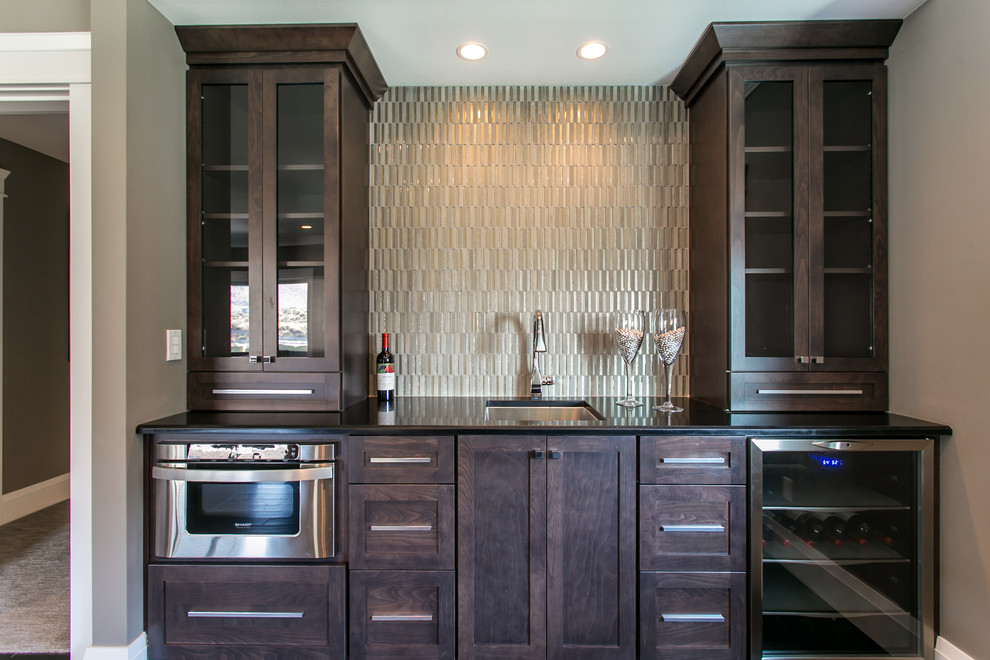 Inspiration for a mid-sized transitional single-wall dark wood floor wet bar remodel in Seattle with an undermount sink, shaker cabinets, dark wood cabinets, quartz countertops, gray backsplash and glass tile backsplash