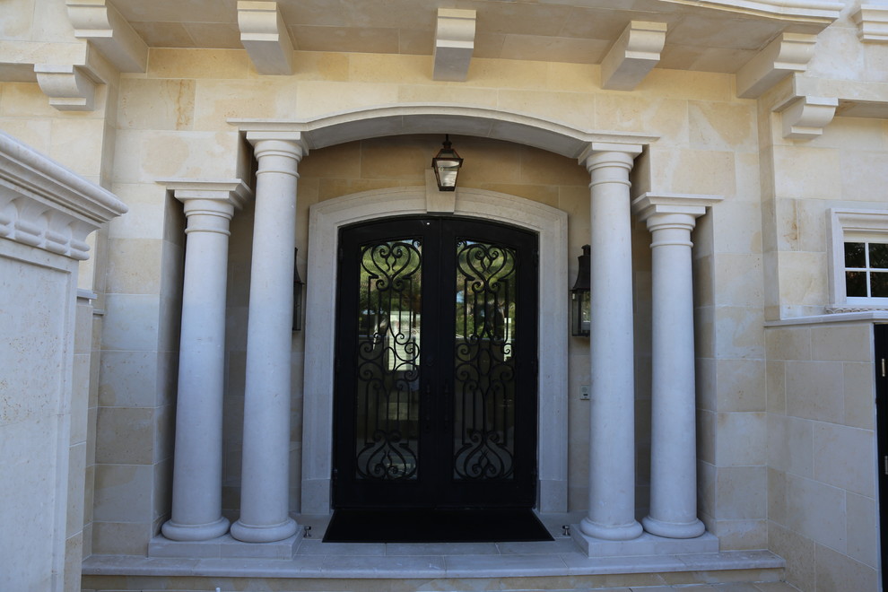Photo of a mediterranean entryway in Miami.