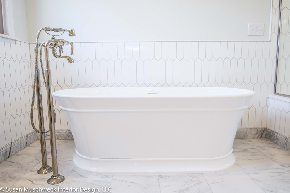 Freestanding bathtub - large transitional master white tile and ceramic tile porcelain tile, white floor and double-sink freestanding bathtub idea with shaker cabinets, gray cabinets, a two-piece toilet, white walls, an undermount sink, quartz countertops, a hinged shower door, white countertops and a built-in vanity