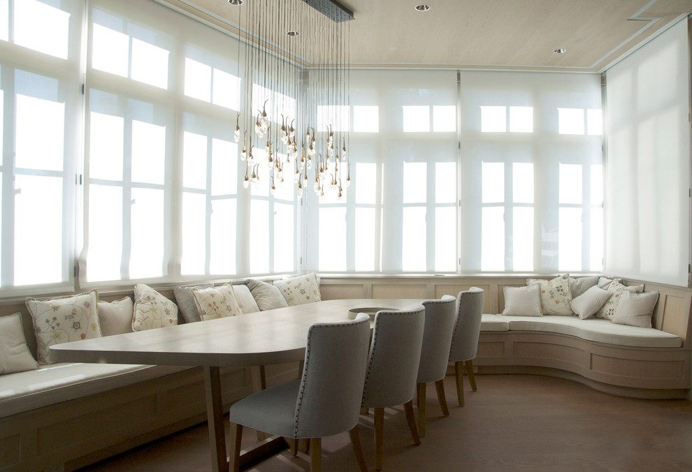 This is an example of a transitional dining room in New York with medium hardwood floors.