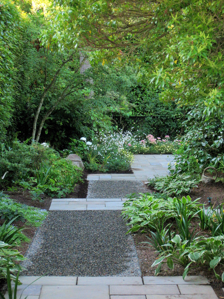 This is an example of a contemporary backyard shaded garden in Seattle.