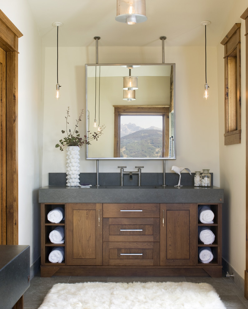 This is an example of a transitional bathroom in Denver with shaker cabinets and dark wood cabinets.