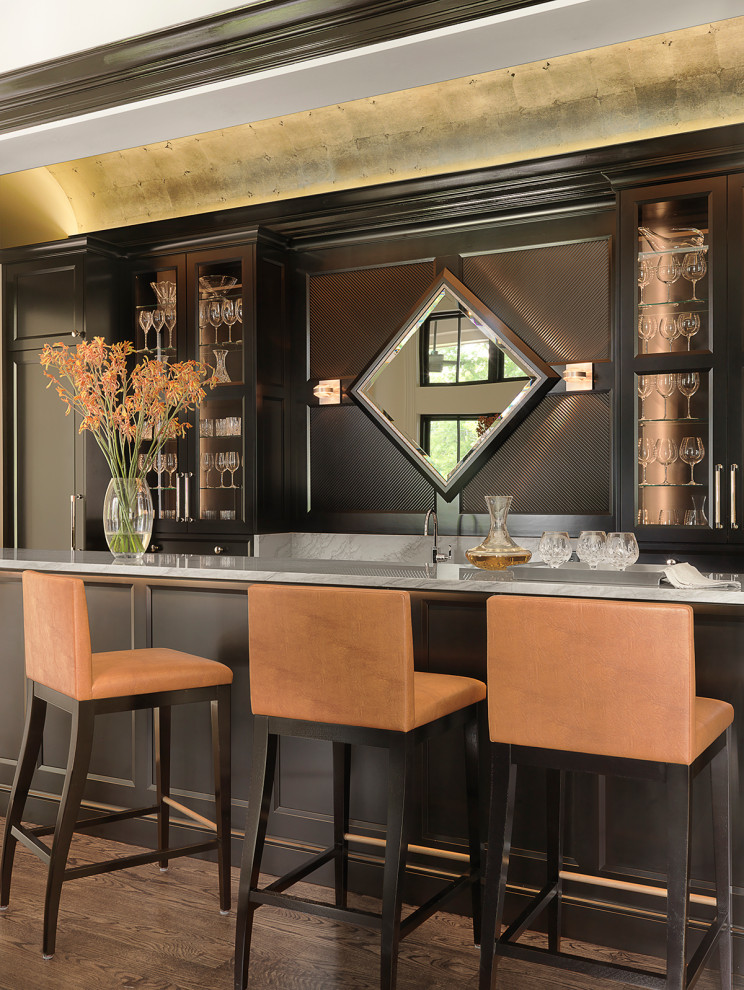 Mid-sized transitional home bar in St Louis.