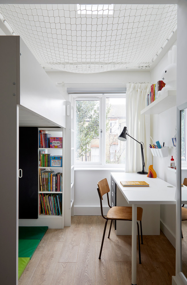 Design ideas for a small scandinavian kids' room in London with multi-coloured walls and light hardwood floors.