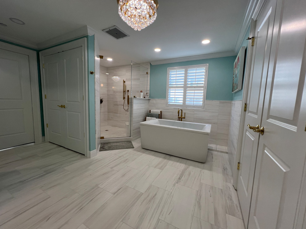 Large midcentury master bathroom in Tampa with flat-panel cabinets, white cabinets, a freestanding tub, a double shower, a one-piece toilet, green tile, marble, green walls, marble floors, an undermount sink, quartzite benchtops, multi-coloured floor, a hinged shower door, white benchtops, a shower seat, a double vanity and a built-in vanity.