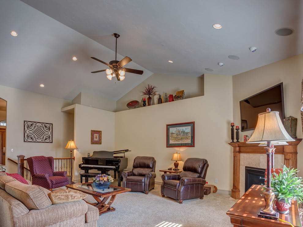 Large arts and crafts open concept family room in Salt Lake City with beige walls, carpet, a corner fireplace and a tile fireplace surround.