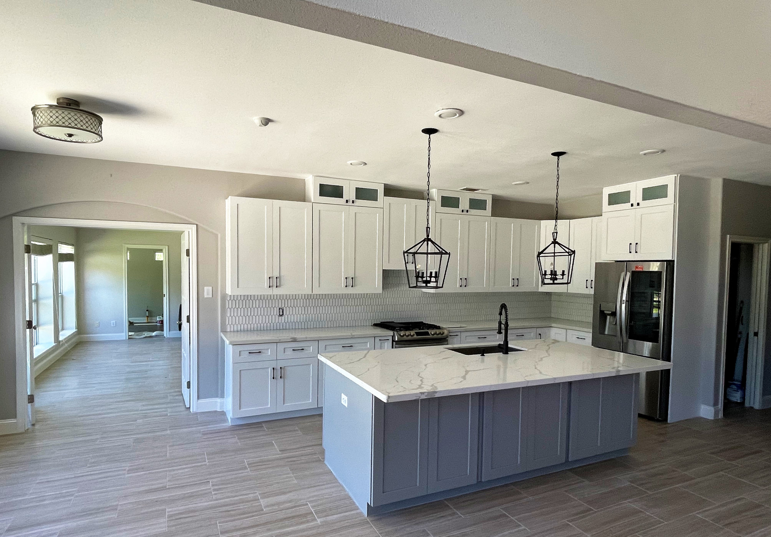 Contemporary Open White Kitchen with grey island and Quartz Countertop