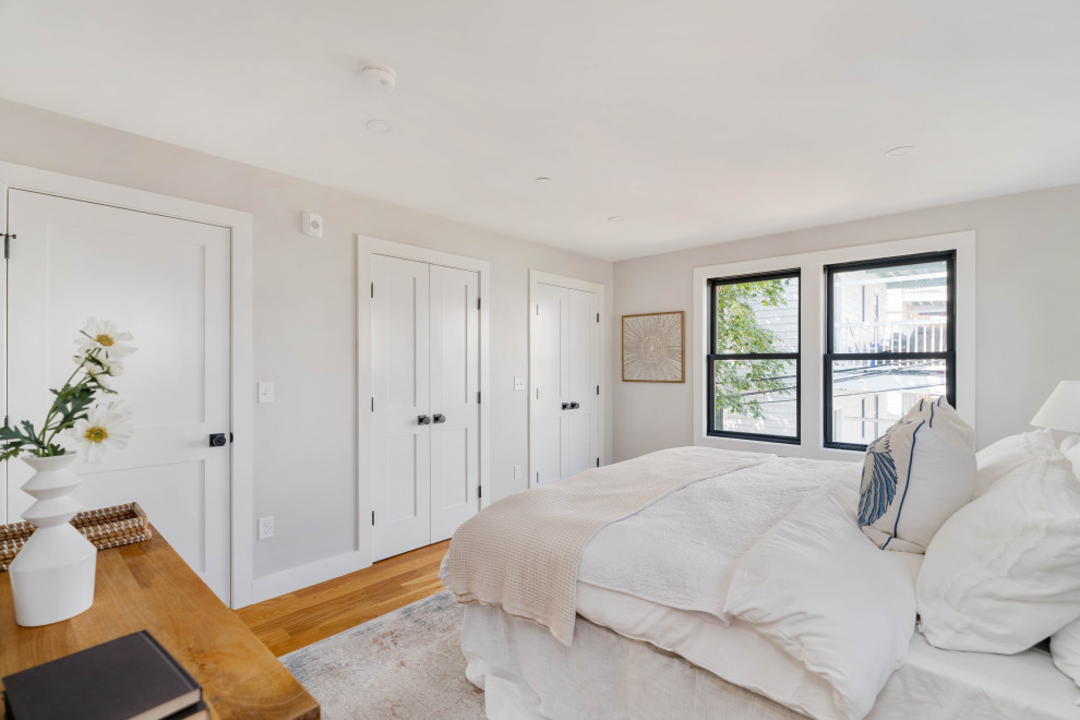 Example of a transitional bedroom design in Boston