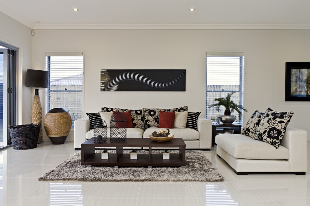 This is an example of a family room in Brisbane with grey walls and grey floor.