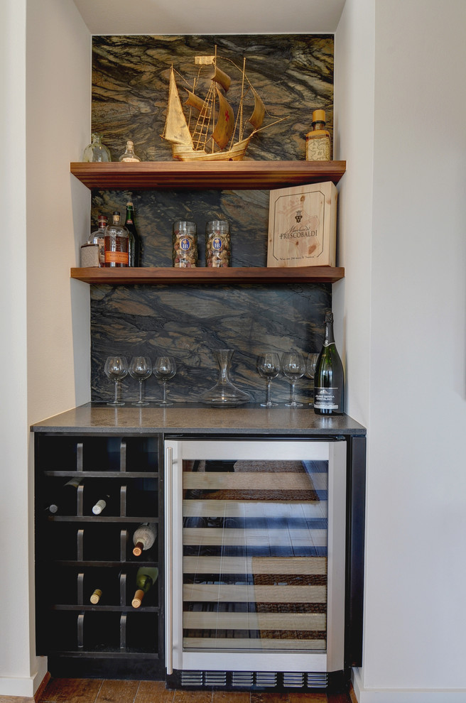 Photo of a small transitional single-wall wet bar in Dallas with no sink, open cabinets, quartzite benchtops, brown splashback, stone slab splashback and medium hardwood floors.