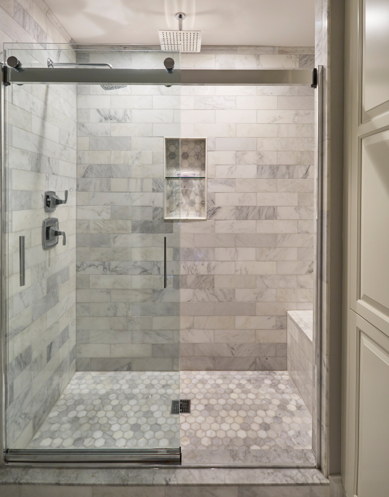 Large coastal ensuite bathroom in Milwaukee with an alcove shower, grey tiles, marble tiles, grey walls, marble flooring, grey floors, a sliding door and a shower bench.