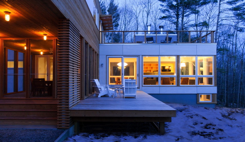 Modern backyard deck in New York with no cover.