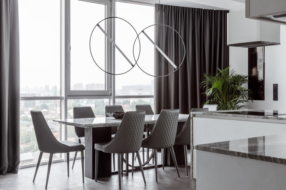 Idee per una grande sala da pranzo aperta verso il soggiorno design con pareti bianche, pavimento in vinile e pavimento grigio