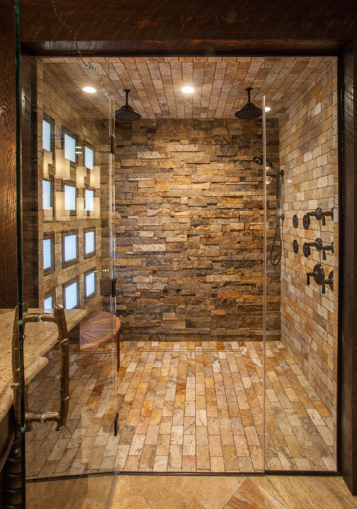 Mid-sized mountain style master beige tile and stone tile travertine floor walk-in shower photo with recessed-panel cabinets, dark wood cabinets, a two-piece toilet, beige walls, an undermount sink and quartz countertops