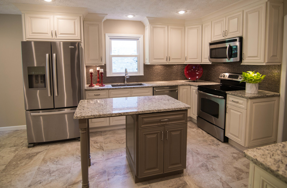 Mid-sized traditional u-shaped eat-in kitchen in Atlanta with a drop-in sink, raised-panel cabinets, white cabinets, granite benchtops, brown splashback, glass tile splashback, stainless steel appliances, porcelain floors and with island.