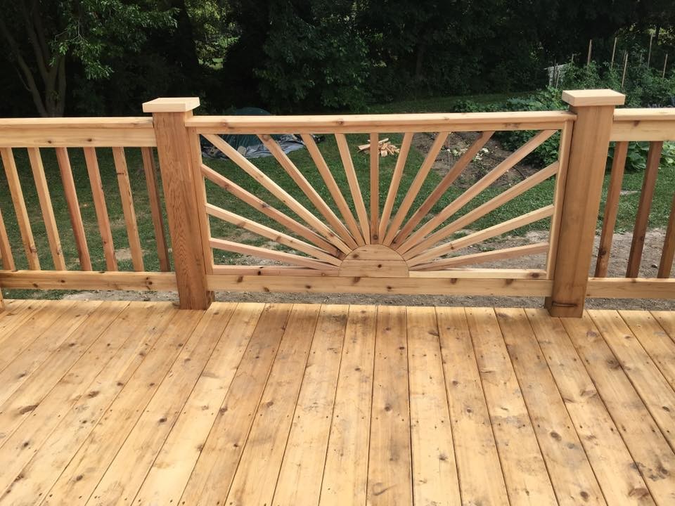 Example of a large transitional backyard deck design in Milwaukee