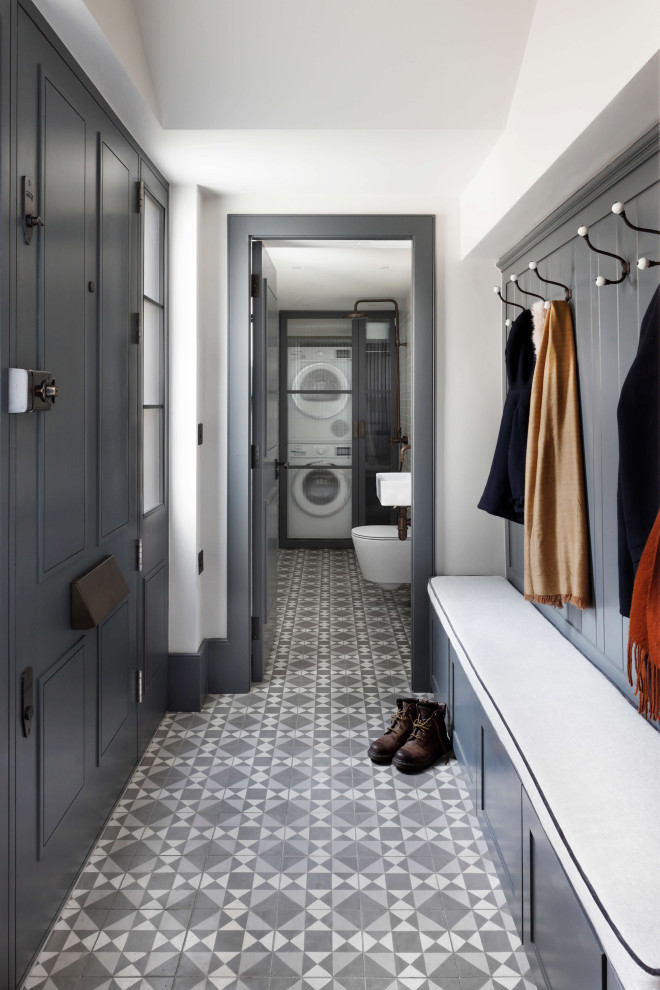 This is an example of a small contemporary mudroom in London with white walls, porcelain floors, a single front door, a gray front door and multi-coloured floor.