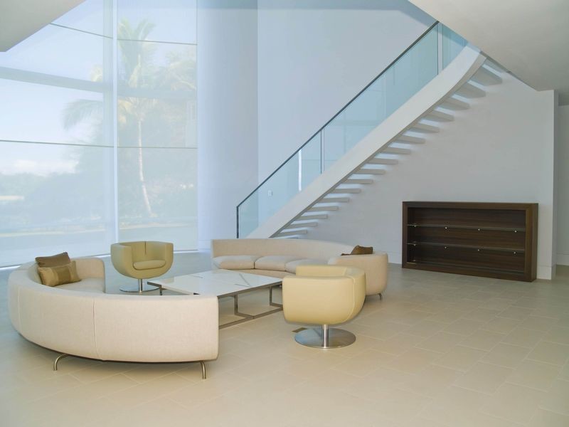 Photo of a large tropical acrylic floating staircase in Other with open risers.