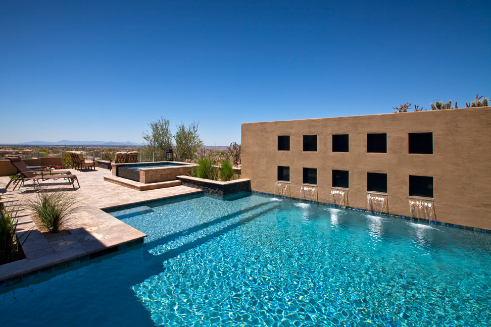 Large minimalist backyard rectangular hot tub photo in Phoenix