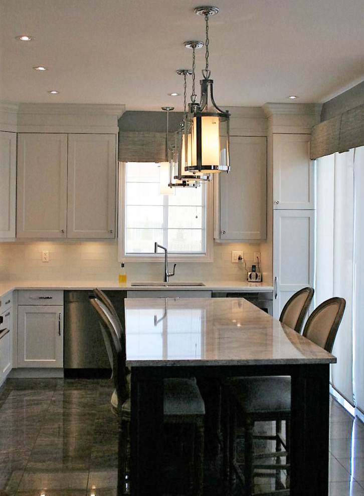 Example of a transitional kitchen design in Toronto