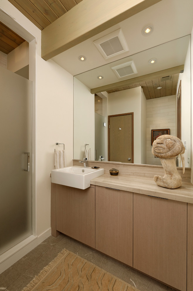 Mid-sized contemporary master bathroom in DC Metro with flat-panel cabinets, light wood cabinets, an undermount tub, a corner shower, a one-piece toilet, white tile, white walls, an undermount sink, wood benchtops, porcelain tile and concrete floors.
