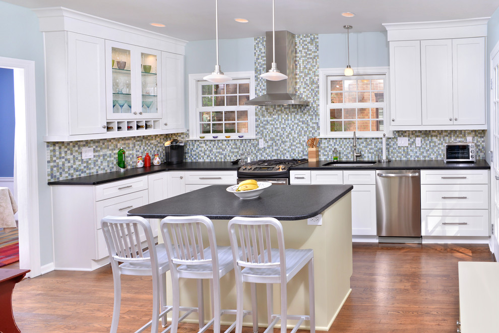 Inspiration for a contemporary kitchen in Cleveland with mosaic tile splashback and stainless steel appliances.
