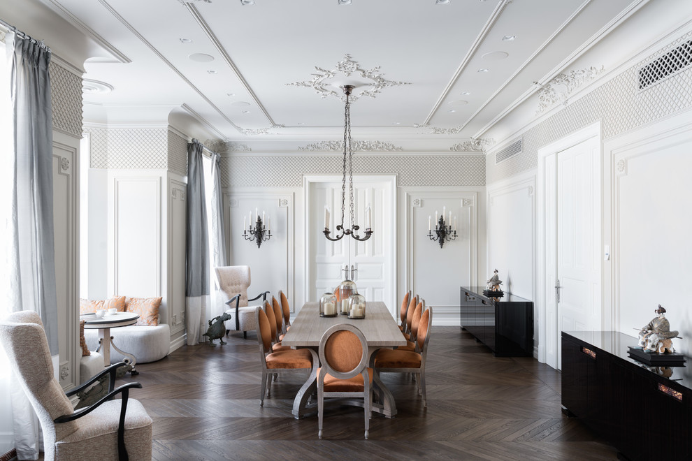 Photo of a traditional dining room in Moscow with white walls and dark hardwood floors.